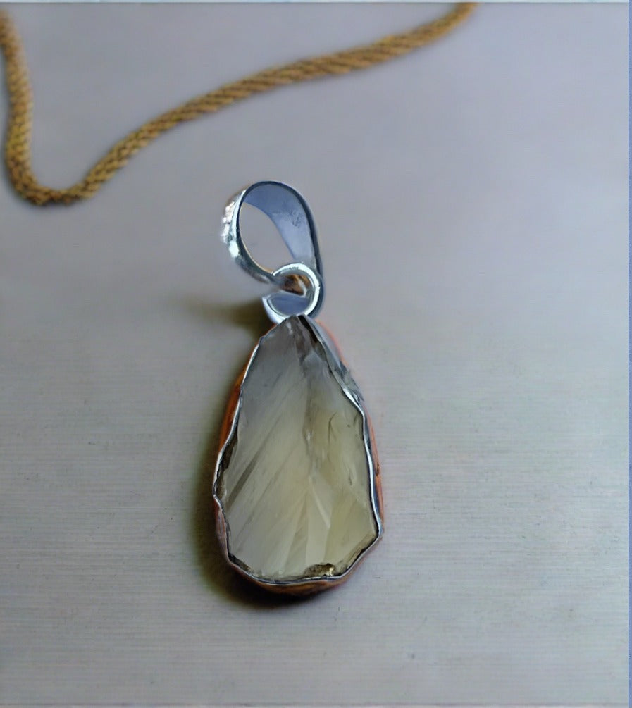 Raw Citrine Pear Shaped Pendant Set In Sterling Silver
