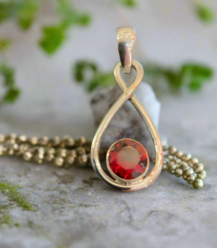 Hand Crafted Garnet Pendant Set In Sterling Silver