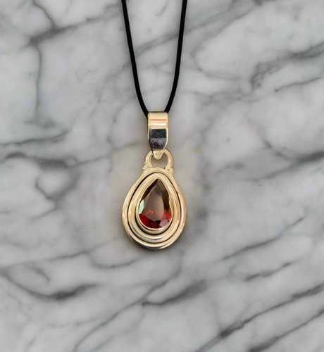 Hand Crafted Garnet Pendant Set In Sterling Silver