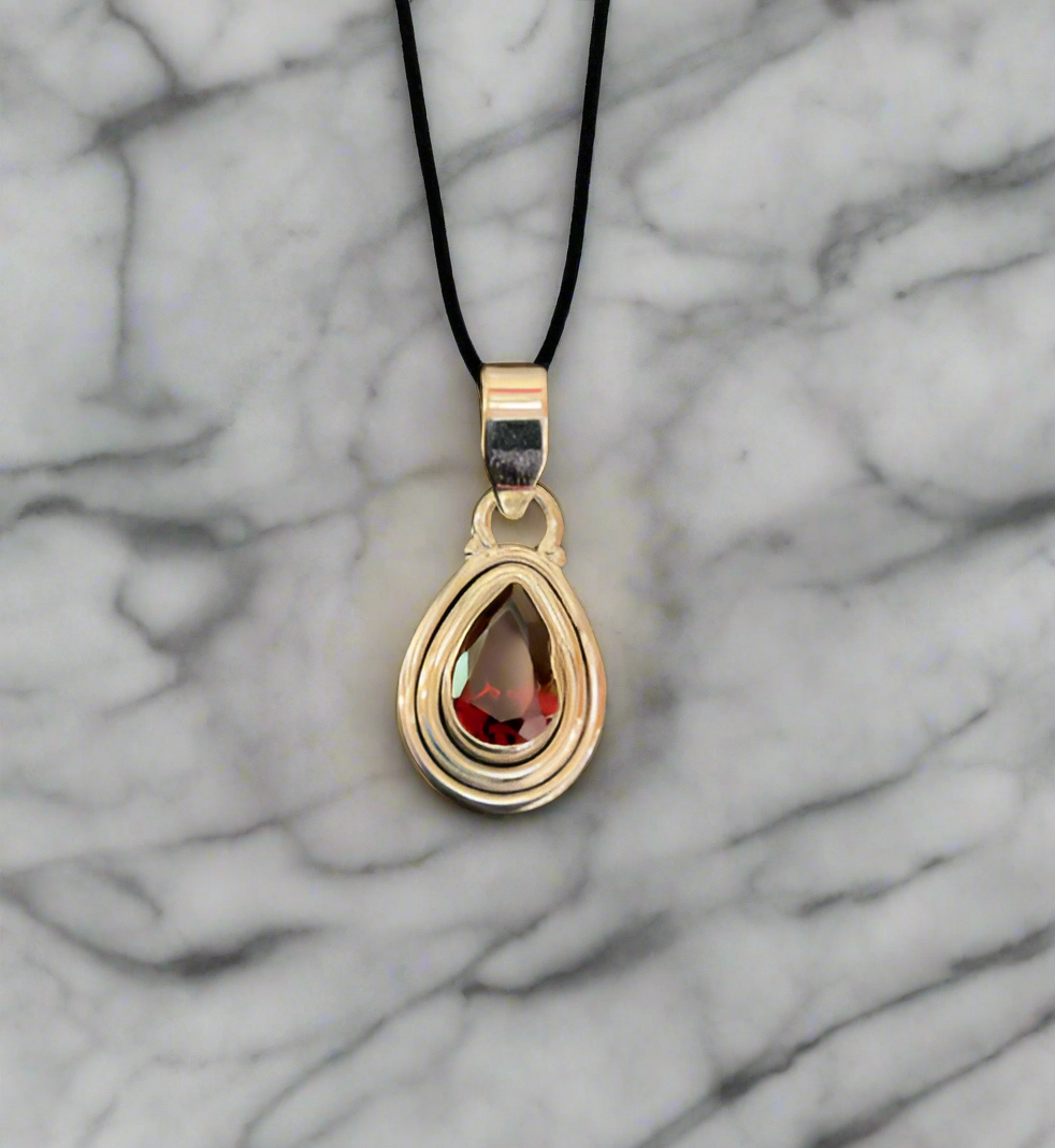 Hand Crafted Garnet Pendant Set In Sterling Silver