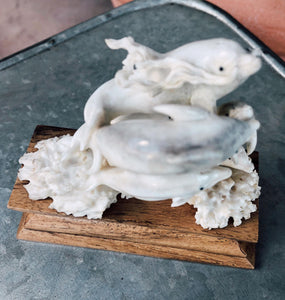 hand carved bone dolphins