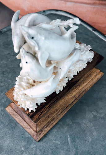 hand carved bone dolphins