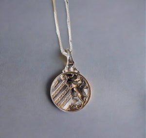 antique button necklace, metal pegasus