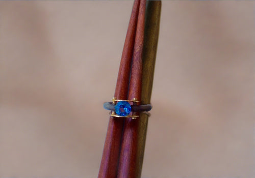 mysterium collection sterling silver and 14k yellow gold tension set blue topaz ring