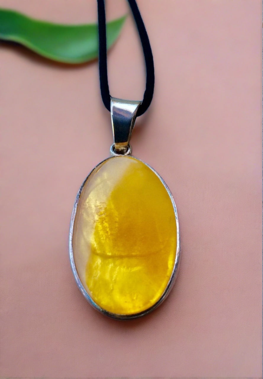 oval baltic butterscotch amber pendant set in sterling silver