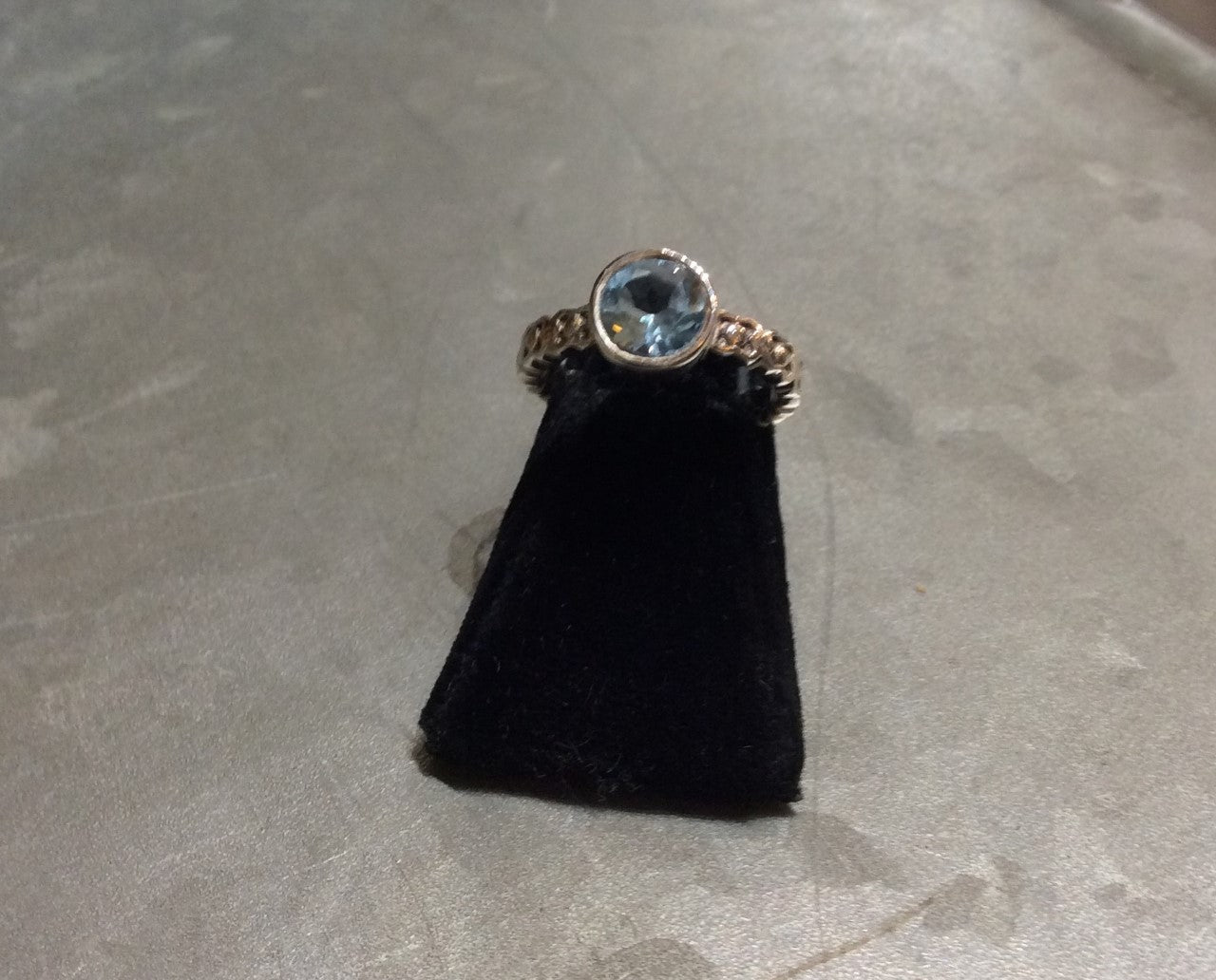 sterling silver round bezel set blue topaz ring