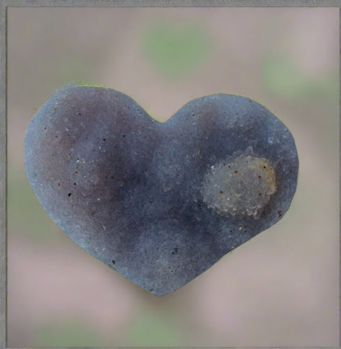 small light amethyst carved heart geode