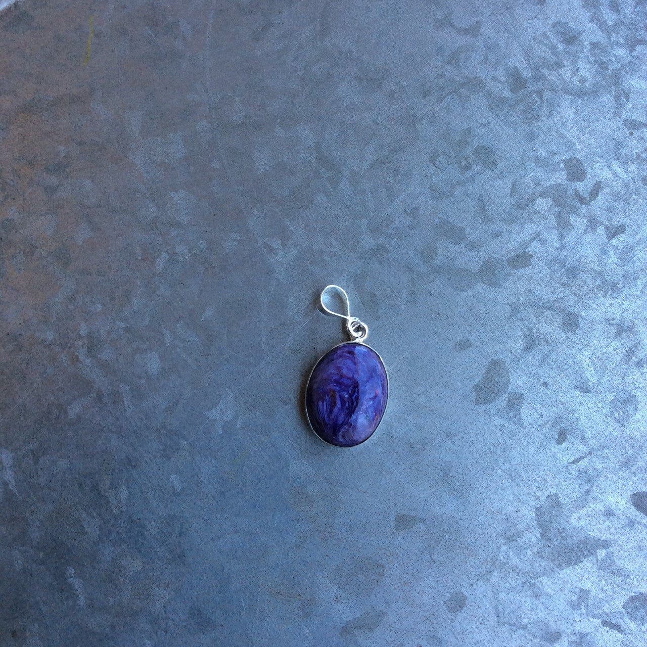 oval charoite pendant set in sterling silver